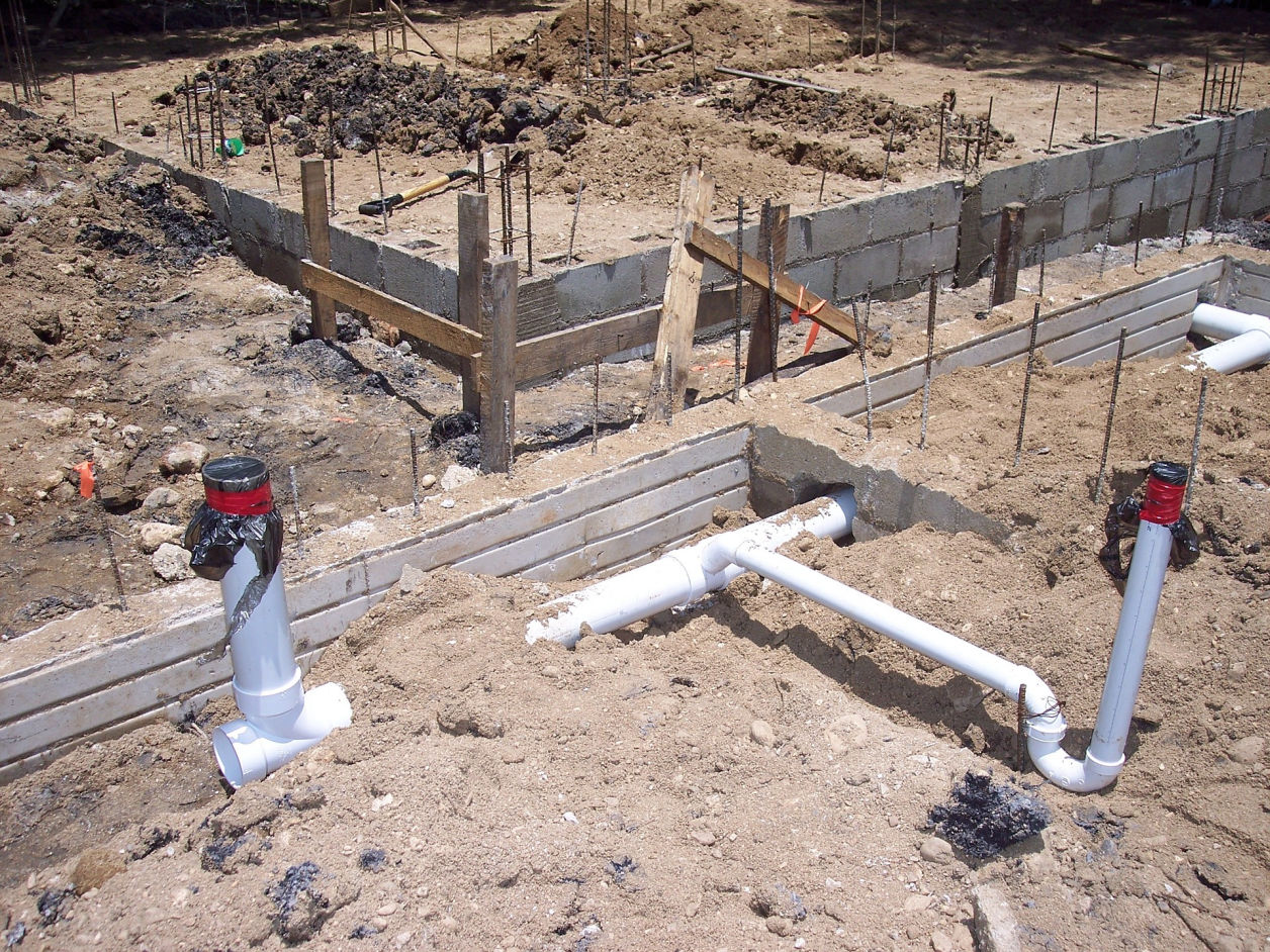 Image: Pouring concrete house foundation.